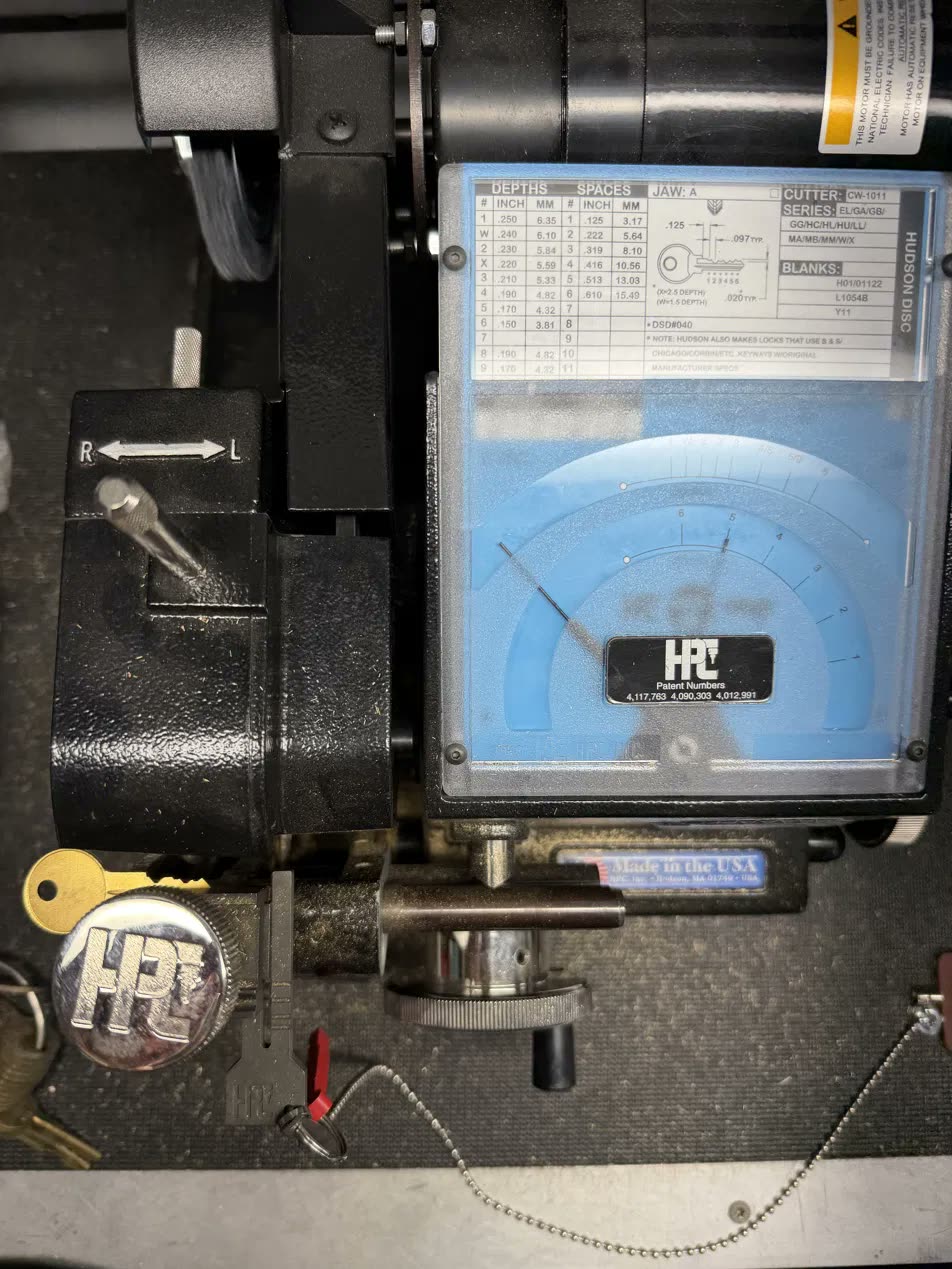 HPC key duplicator cutting a brass key