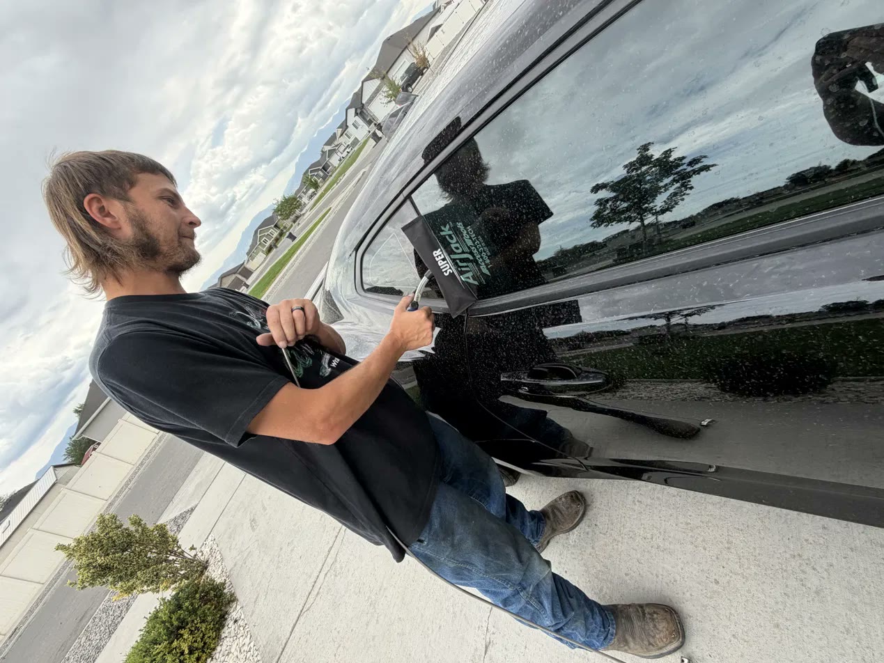 David opening a locked car with an air wedge on a real lockout call